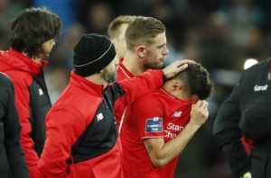 Football Soccer - Liverpool v Manchester City - Capital One Cup Final - Wembley Stadium - 28/2/16
 Liverpool's Philippe Coutinho and teammates are dejected after losing the match with a penalty shootout
 Action Images via Reuters / John Sibley
 Livepic
 EDITORIAL USE ONLY. No use with unauthorized audio, video, data, fixture lists, club/league logos or "live" services. Online in-match use limited to 45 images, no video emulation. No use in betting, games or single club/league/player publications.  Please contact your account representative for further details.