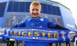 A young Leicester City fan with a 'Premier League Champions' scarf before the Barclays Premier League match between Leicester City and Southampton played at The King Power Stadium, Leicester on April 3rd 2016